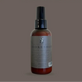 Bottle of Smokeshow room & linen spray on a gray background