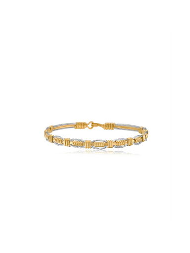Gold and silver bracelet on a white background