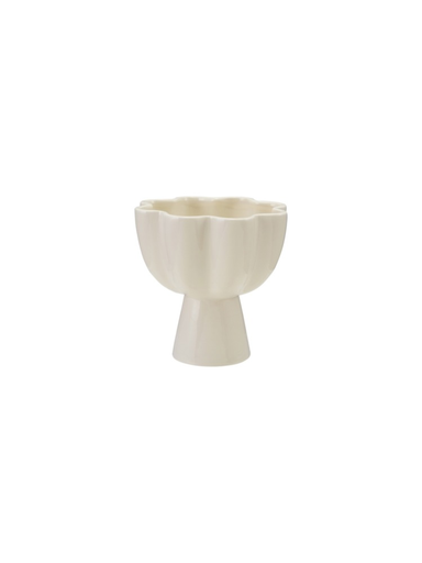 Cream stoneware flower-shaped pedestal bowl with scalloped petal edges and smooth neutral finish.