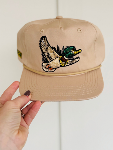 flying duck with a hat and chain on a tan hat