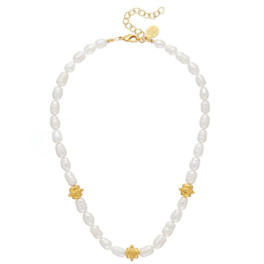 Pearl necklace with gold accents on a white background