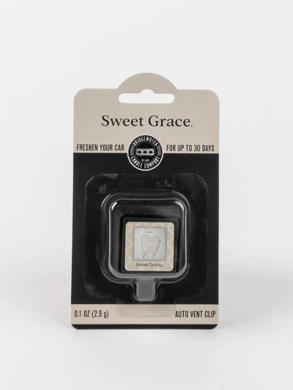 A packaged Sweet Grace car vent clip fragrance 