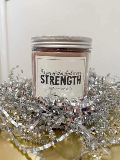 Sweet Grace Candle jar with 'The joy of the Lord is my strength' label on a glass jar