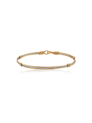 A silver and gold wire bracelet by Ronaldo, a timeless piece that can be used for years to come 