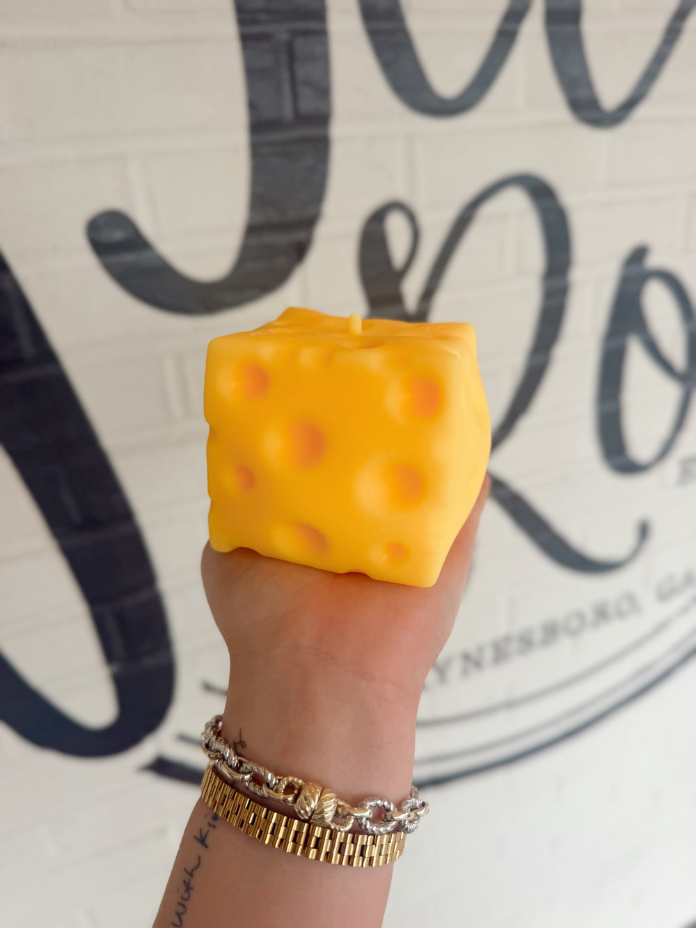 Soft cheese-shaped squishy toy with a creamy texture designed for stress relief and sensory play.