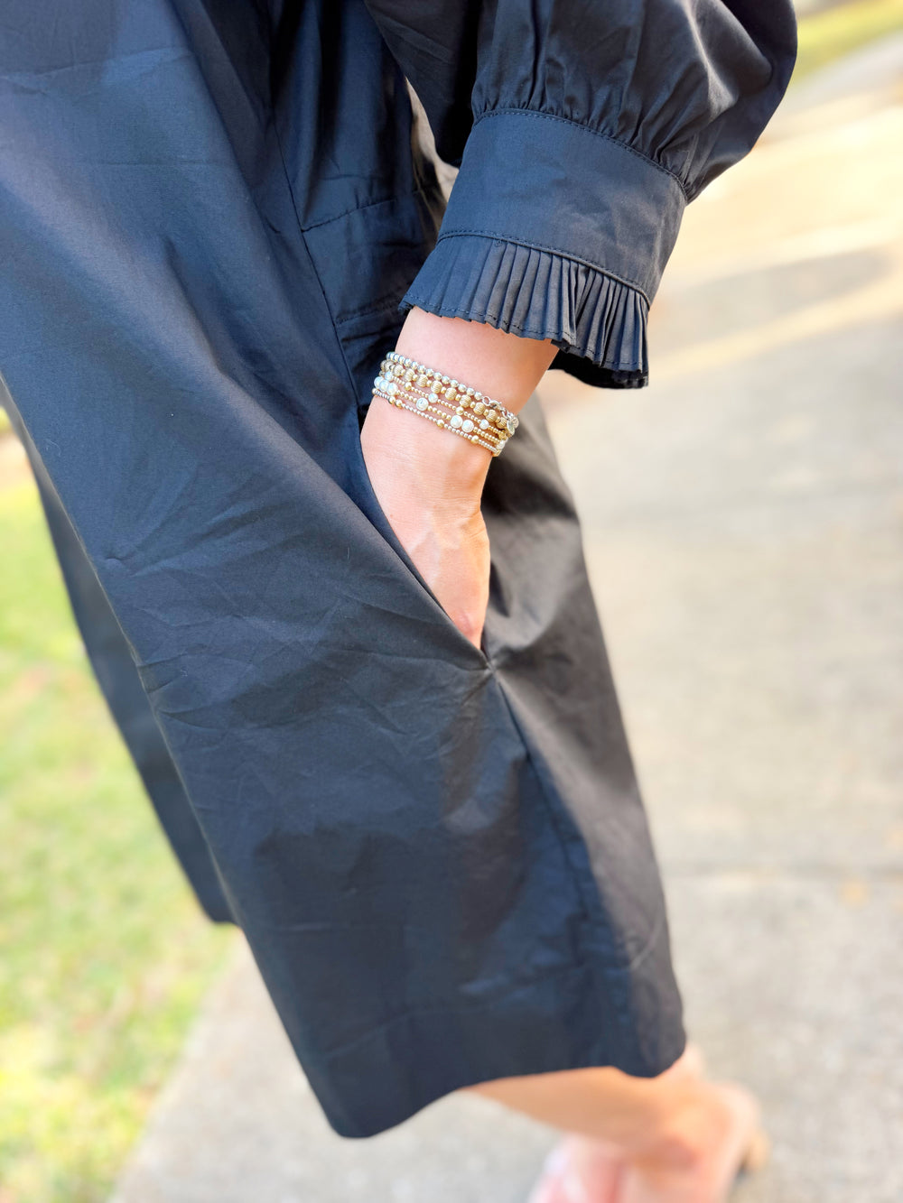The Greer Ruffle Mini Dress in Black (S-L)