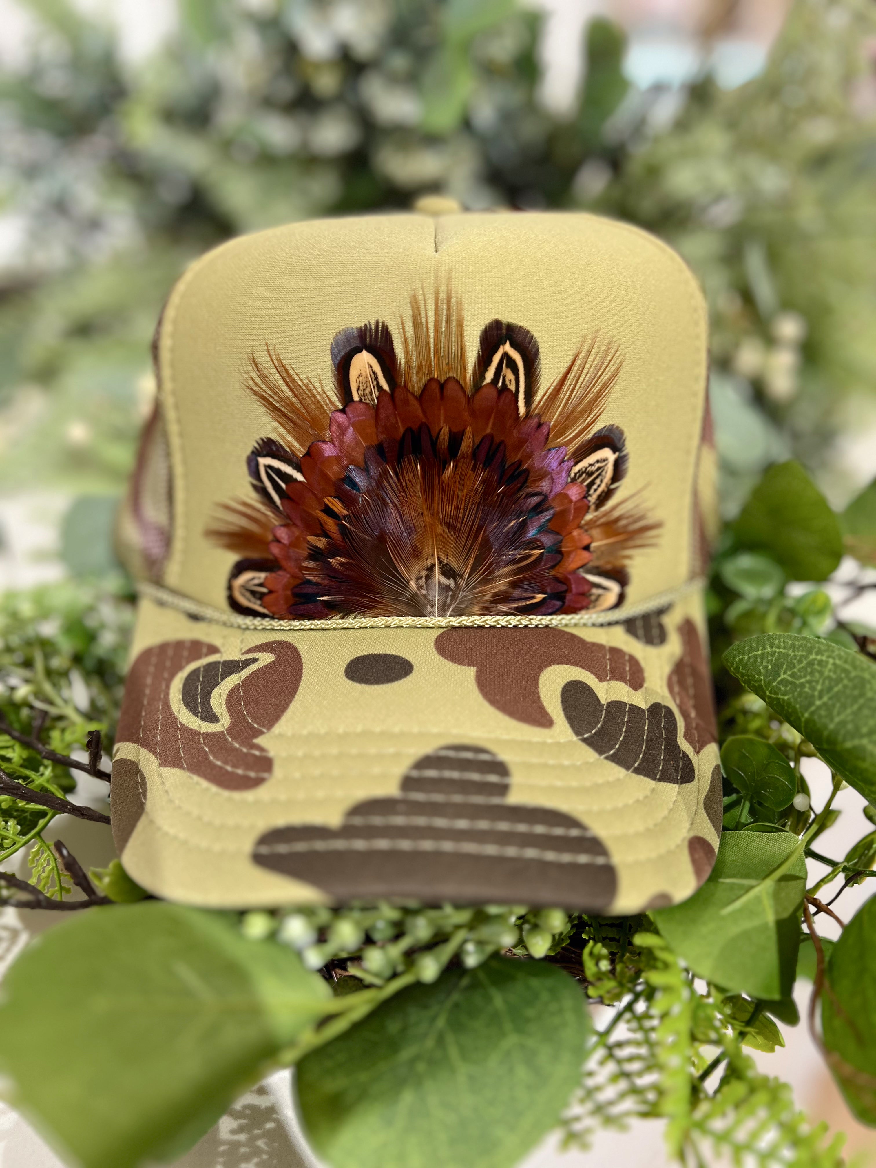 The Genevieve Camo Feathered Trucker Hat