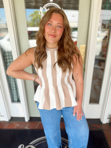 Sleeveless striped top with ruffle bottom