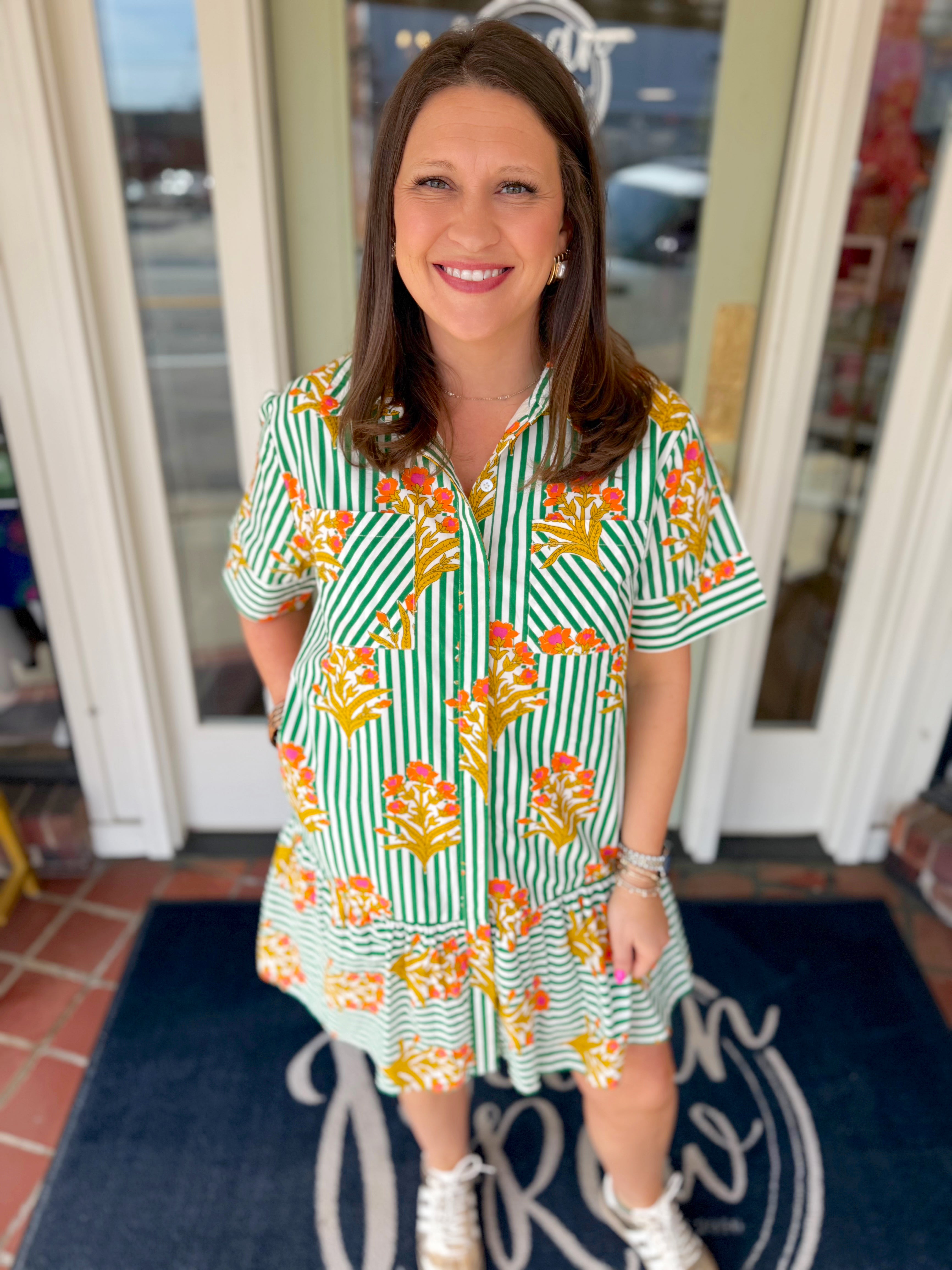Green and white striped mini dress with floral print and front pockets