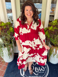This maxi dress features an allover floral print with a tiered silhouette that gives it beautiful movement. 