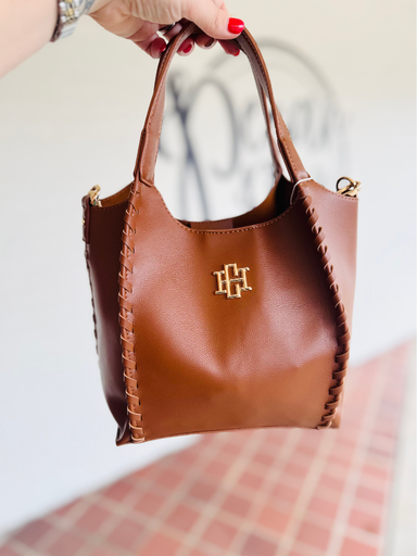 saddle brown saddle bag with extra strap