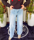 Light wash wide leg jeans with a pin tuck detail
