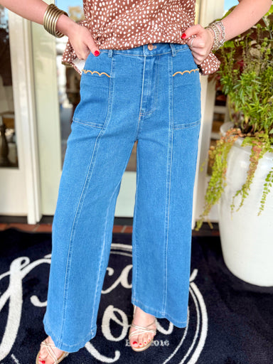 Jeans that feature a high-rise fit, oversized front patch pockets and contrast scalloped trim along the pocket openings