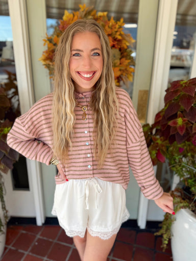 This cardigan features blush pink and brown stripes for an easy pop of color without feeling too bright. 