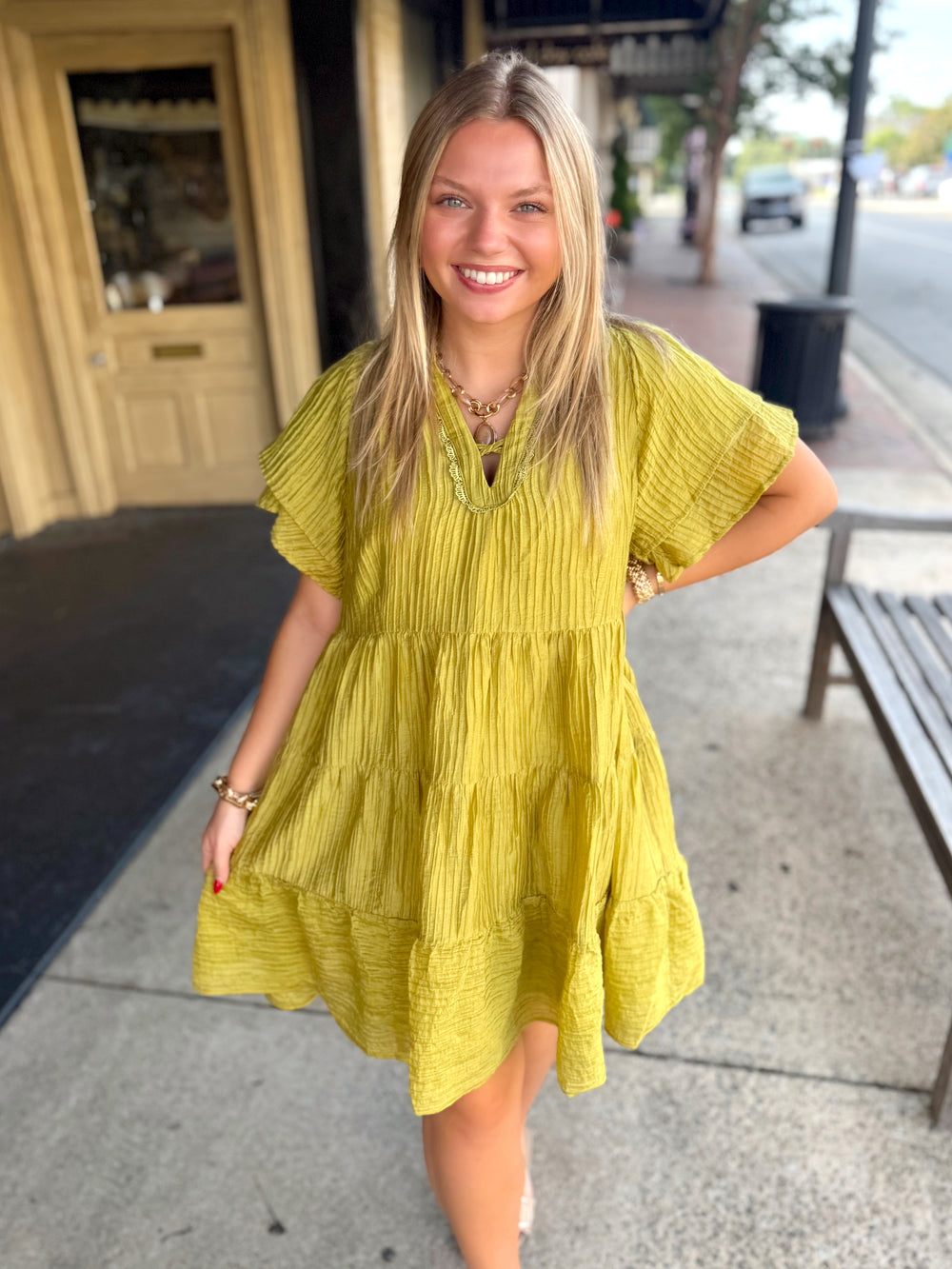 A tiered mini ruffle dress with pockets 
