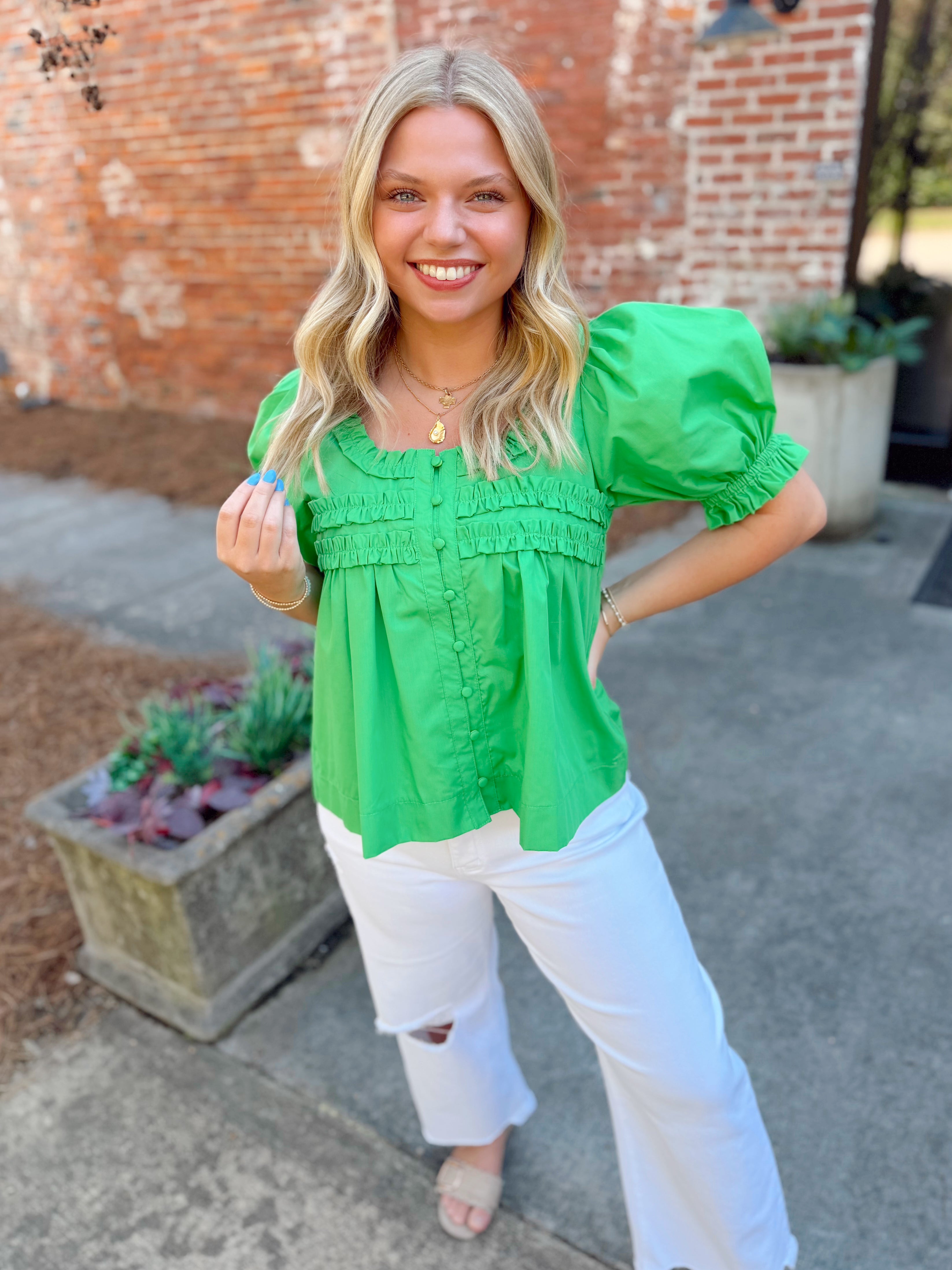 Green puff sleeve top with button detailing down the front 