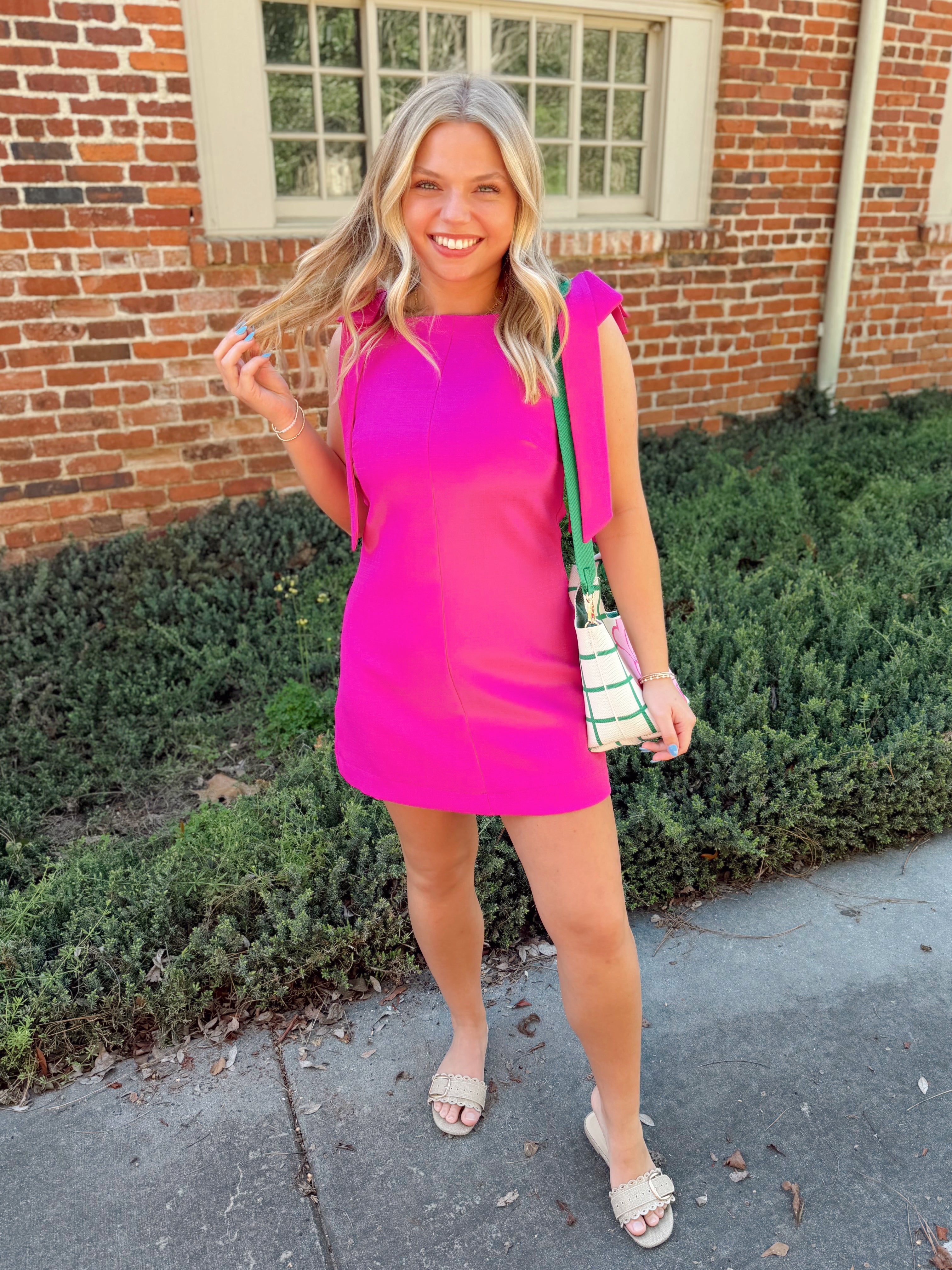 Magenta dress with bow detailing on the straps