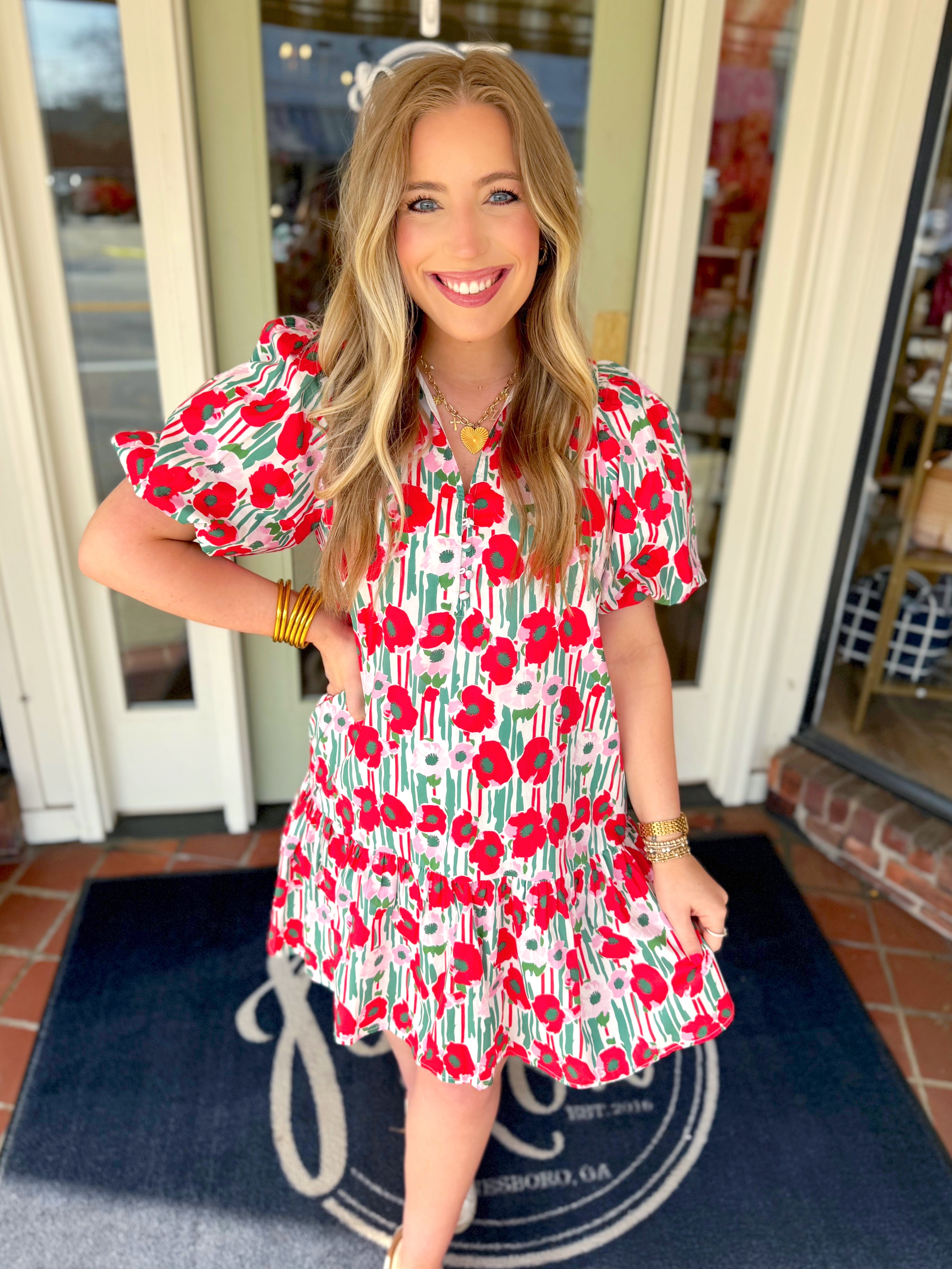 Red, green, pink, and white floral mini dress with subtle puff sleeves