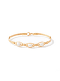 Gold bracelet with pearls on a white background