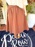  This rich brown maxi features a smooth fitted yoke that flows into a gathered, full silhouette for a flattering shape with plenty of movement. 