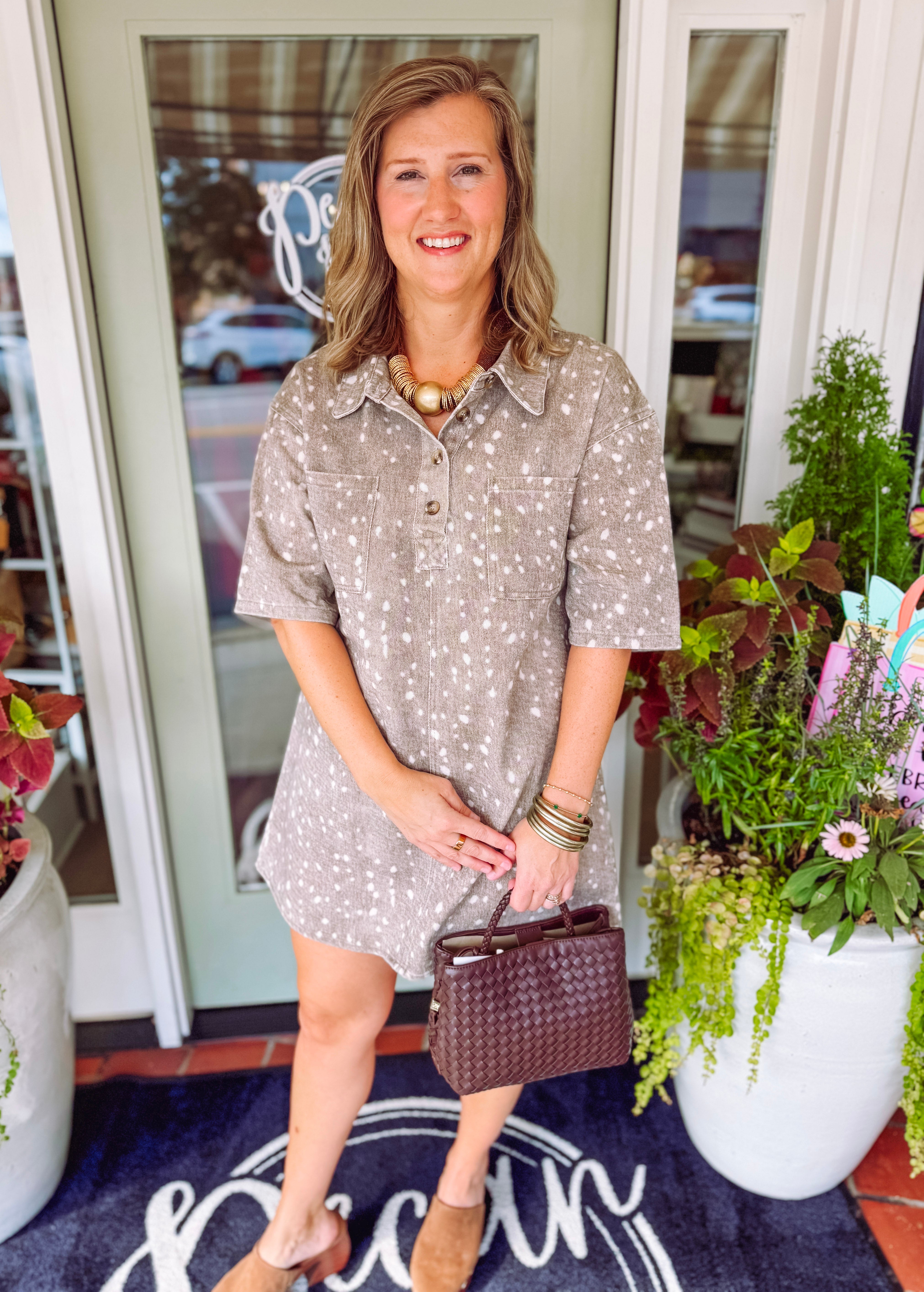 Bambi printed dress with a collar neckline and two front pockets.