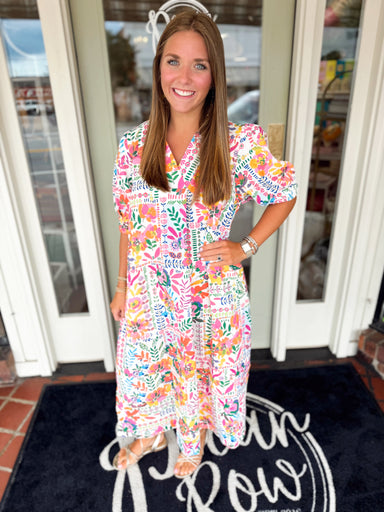 Colorful floral midi dress with subtle puff sleeves and pockets