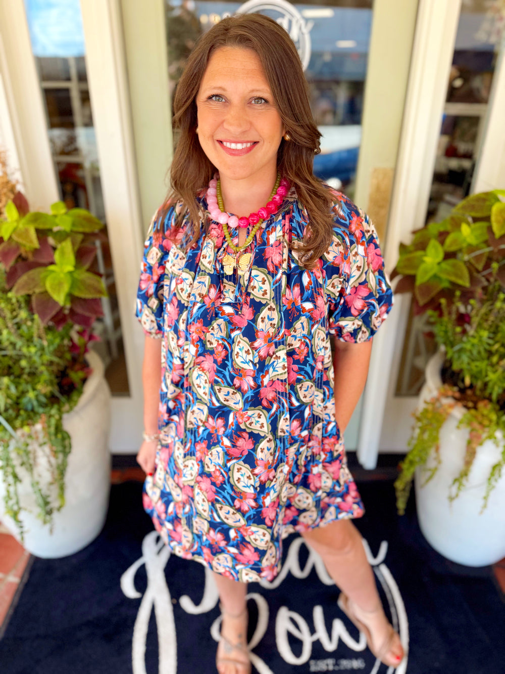 A botanical printed dress with a subtle puff sleeve 