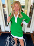 Green v-neck dress with white trim detailing 