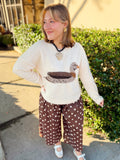 This soft cream knit features a mallard duck design in warm neutral shades of brown, gray, and rust.