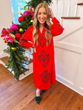 red slip like dress with plaid details on the arms and front 
