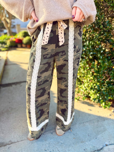 Featuring a classic olive camouflage print, these relaxed wide-leg pants are trimmed with cream crochet lace for the prettiest unexpected contrast.
