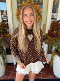 This brown knit cardigan features cream polka dots throughout with a button-front design that makes it just as cute worn alone as it is layered.