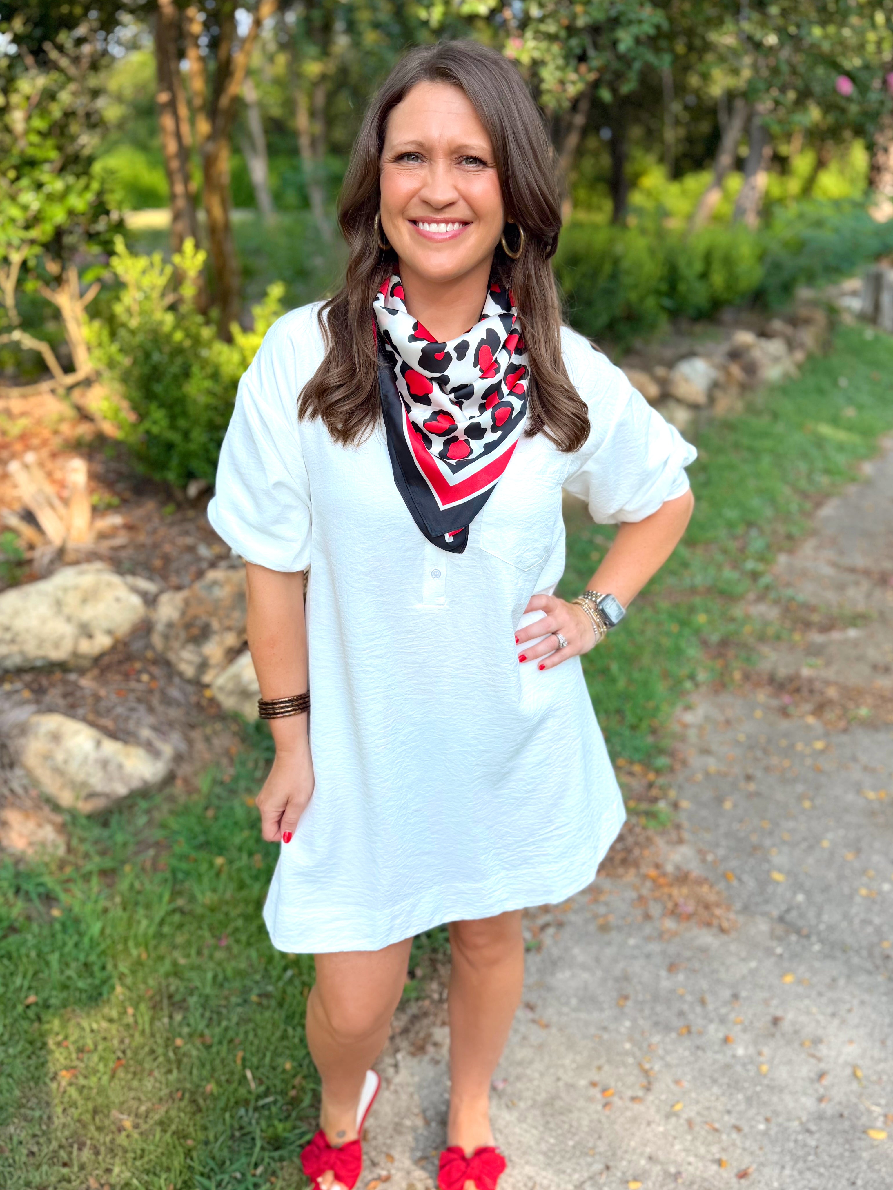 A white short-sleeve tunic dress
