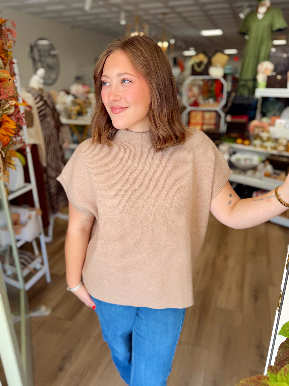 This sweater top features a classic mock neckline with a soft knit feel and an effortlessly polished silhouette.