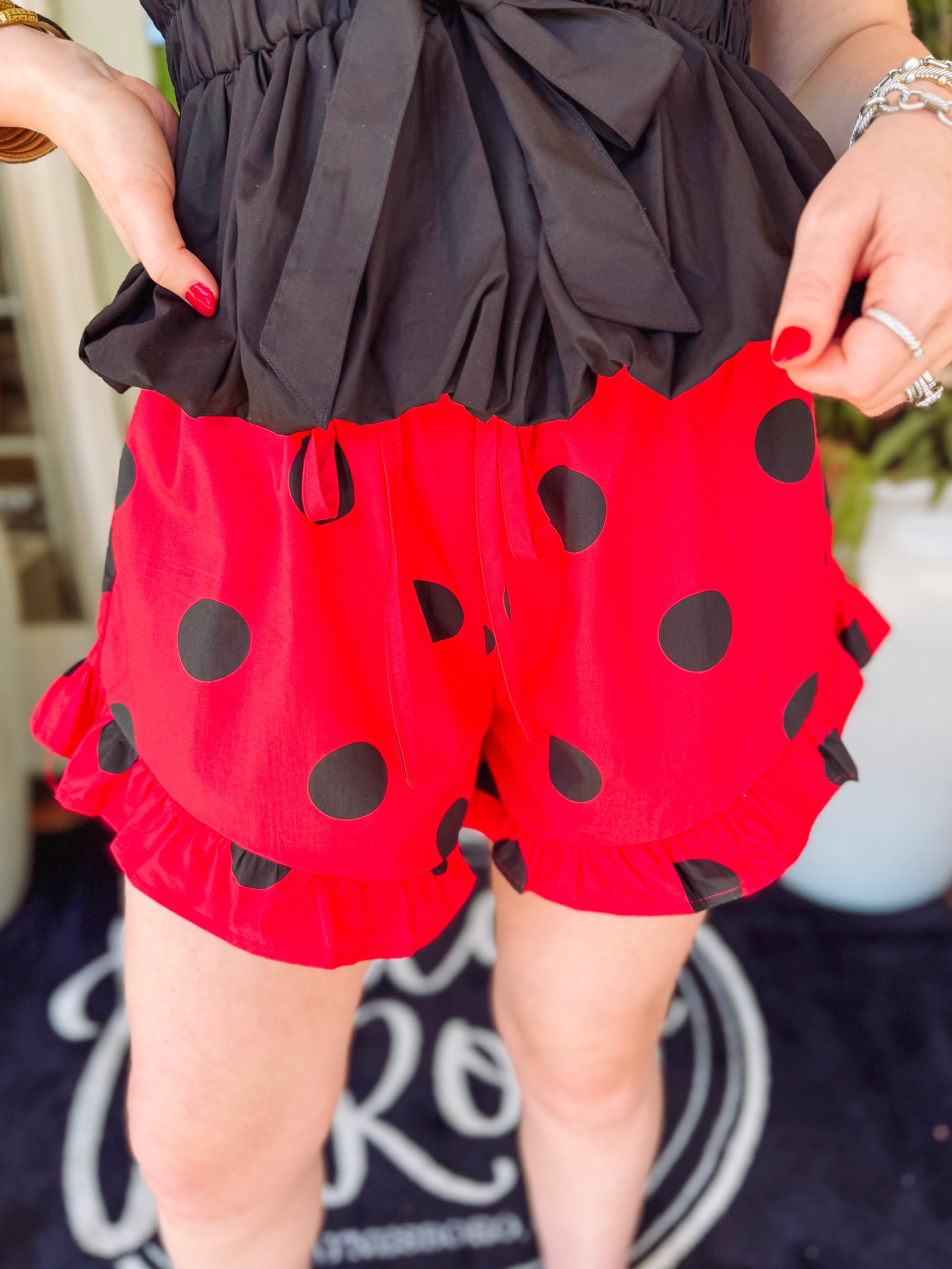 Elastic waist red shorts with black polka dots