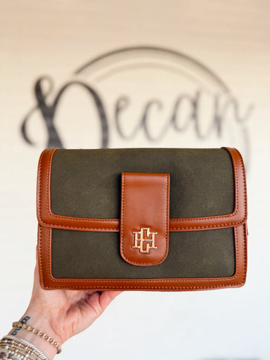  This olive crossbody features a structured silhouette with a soft suede-inspired finish and smooth tonal trim. 