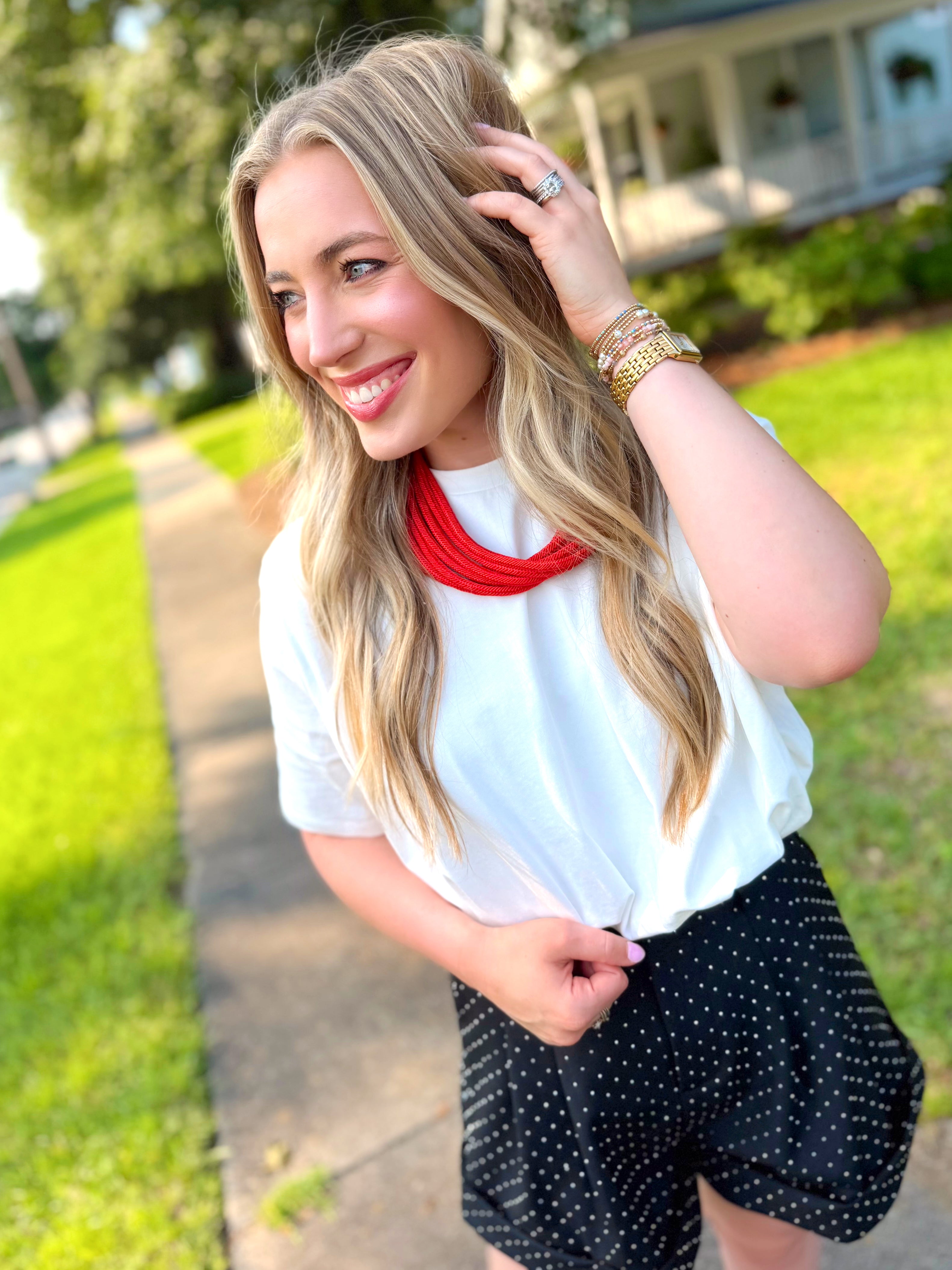 A white short-sleeve bubble top.