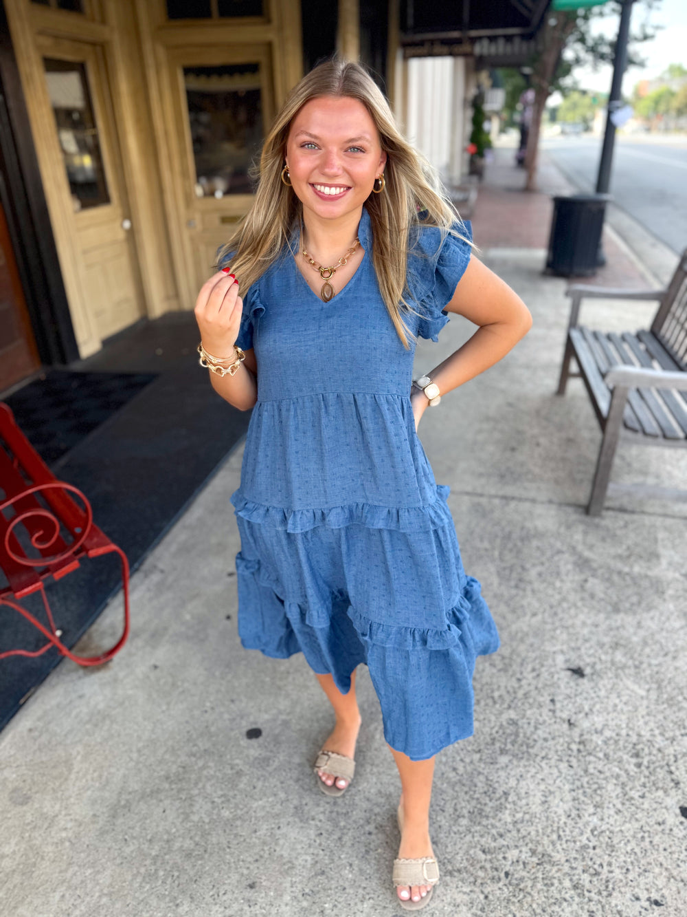 A blue v-neck tiered ruffle detailed dress 