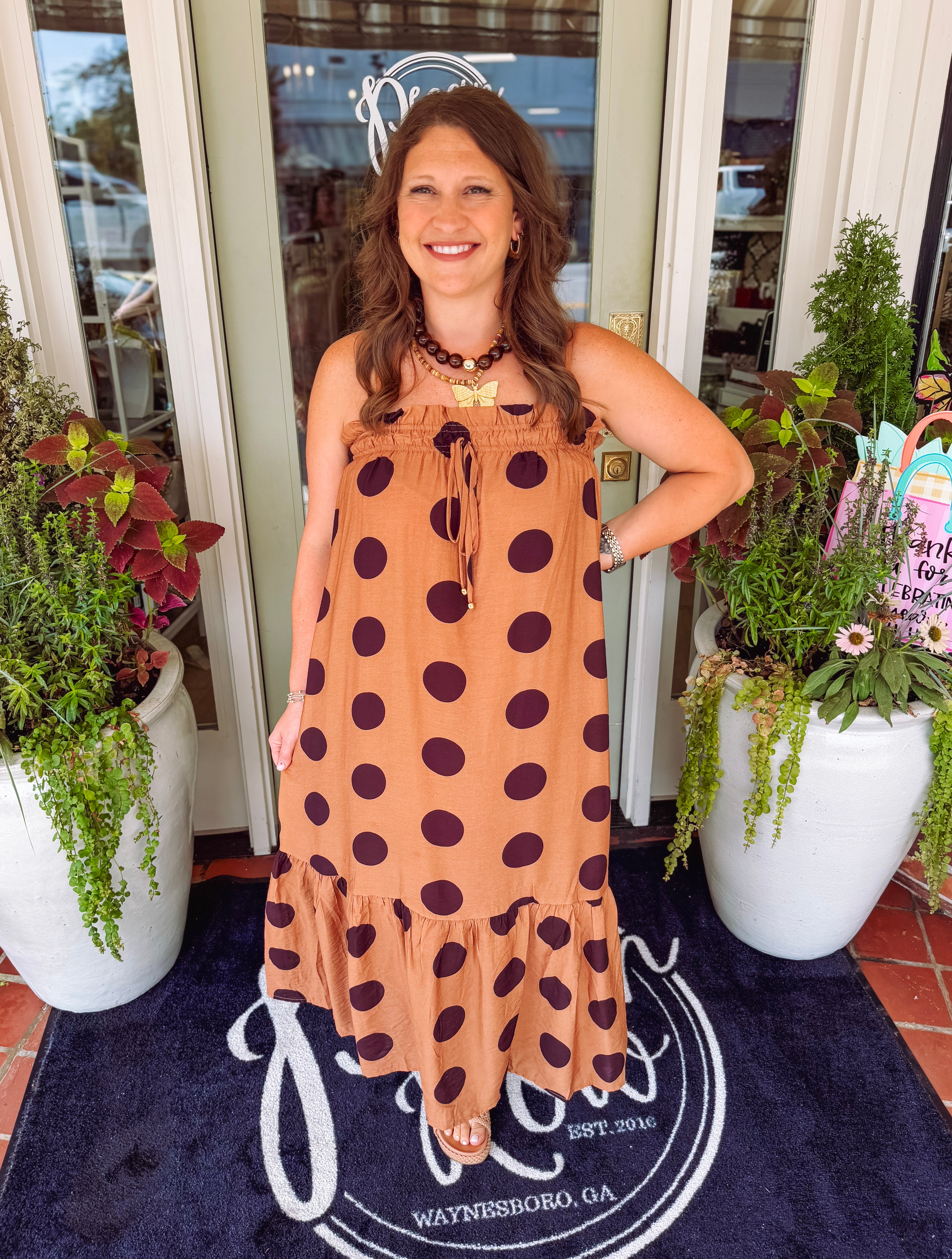 Camel and brown polka dot dress with pockets and elastic detailing at the top 