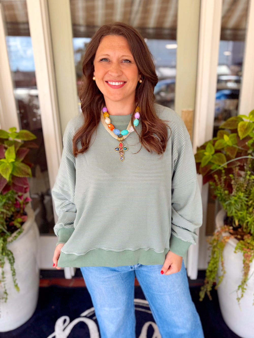 A subtle striped green oversized sweatshirt 
