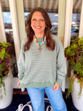 A subtle striped green oversized sweatshirt 