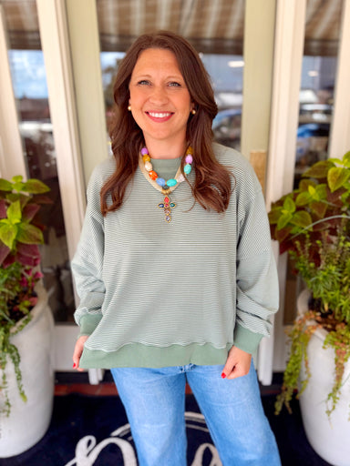 A subtle striped green oversized sweatshirt 