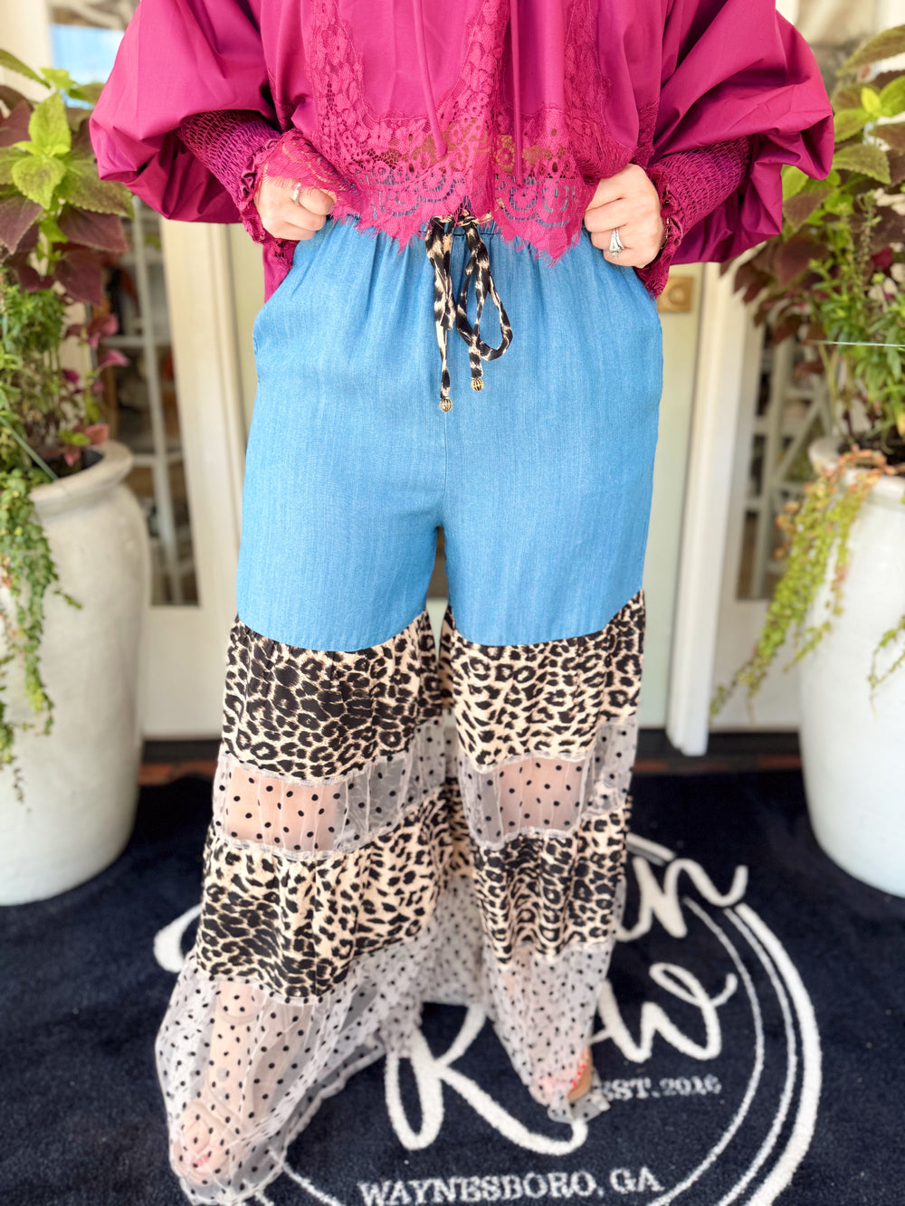  These flowy pants feature a mixed leopard print and sheer polka dot tiers for a bold, fun look!