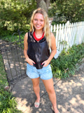 A sleeveless black satin top with a v-neck