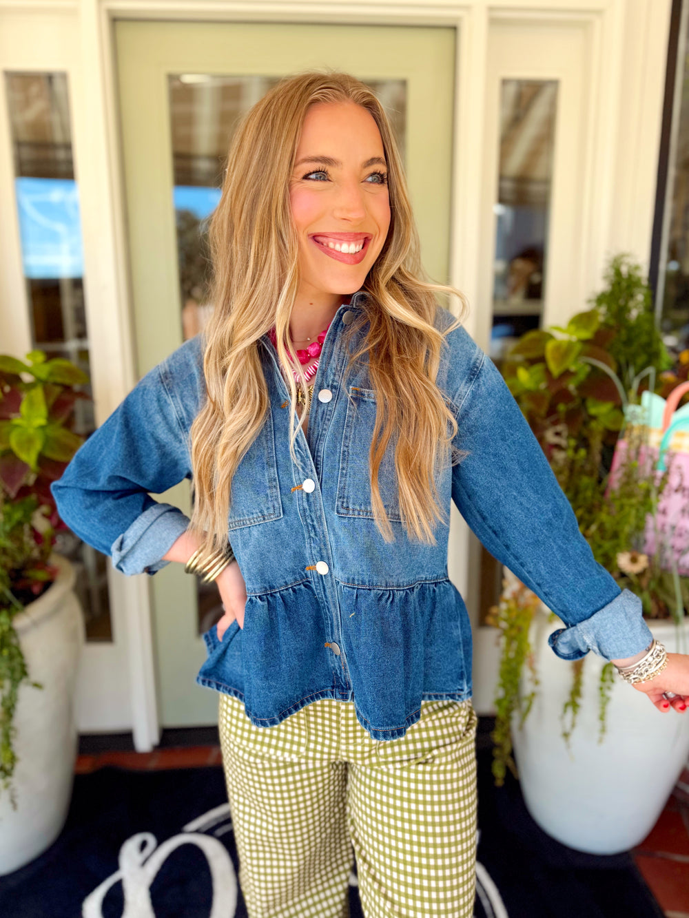 Button down denim top with a ruffle peplum silhouette 