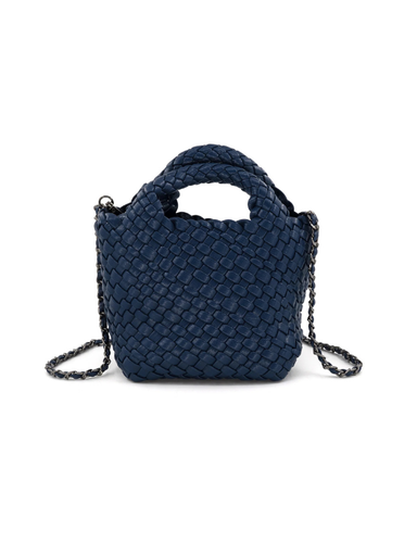 A navy blue woven leather handbag with a top handle and a thin chain shoulder strap]