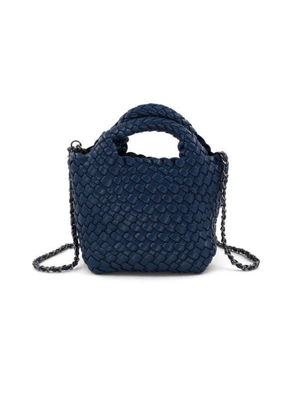 A navy blue woven leather handbag with a top handle and a thin chain shoulder strap]