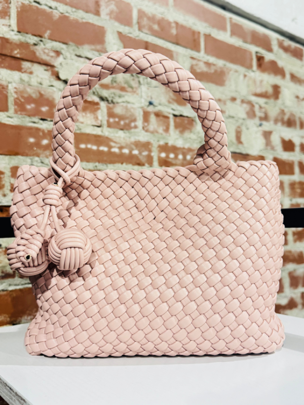 The Evelyn Braided Clutch in Soft Pink with monkey fist