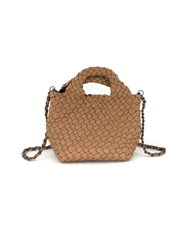 A small woven leather handbag in a warm tan-brown color, featuring a top handle and a braided shoulder strap
