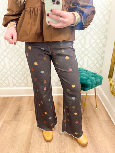 These dark wash jeans feature a colorful scattered dot print that gives them just the right amount of personality.
